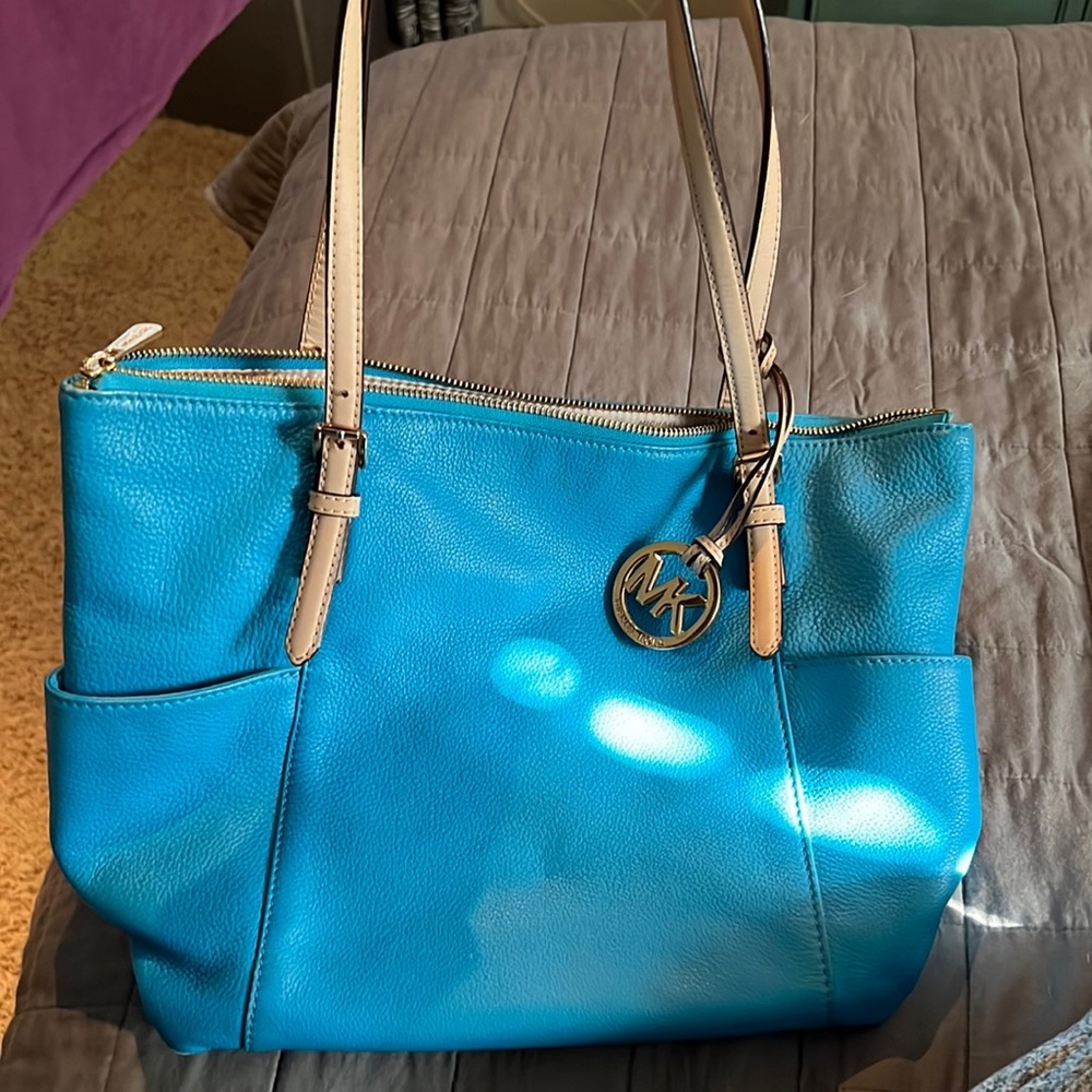 Blue gently used Michael Kors bag! Just don’t use anymore!